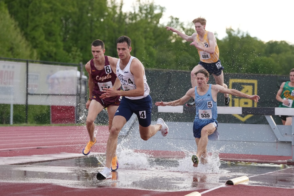 Yoni Haim leading the pack through the steeplechase water jump