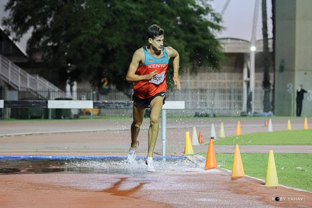 Yoni Haim clearing the water jump in the steeplechase